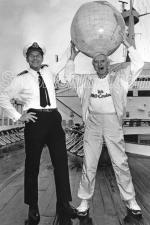 ID 4776 CANBERRA (1961/44807grt/IMO 5059953) - Commander Ian Gibb and veteran English TV and radio personality and dedicated cruise fan Sir Jimmy Savile, OBE, KCSG (31 October 1926 - 29 October 2011) pose for...
